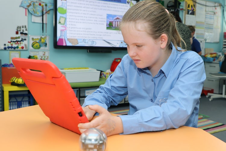 Student with orange ipad