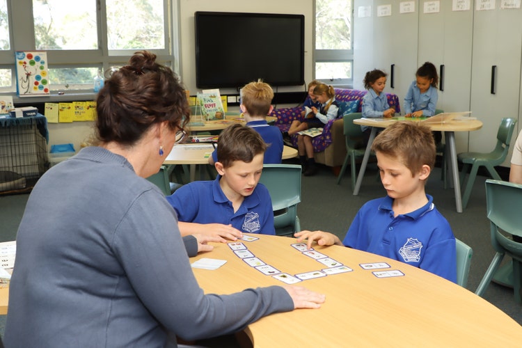 Students learning with Miss Grewal